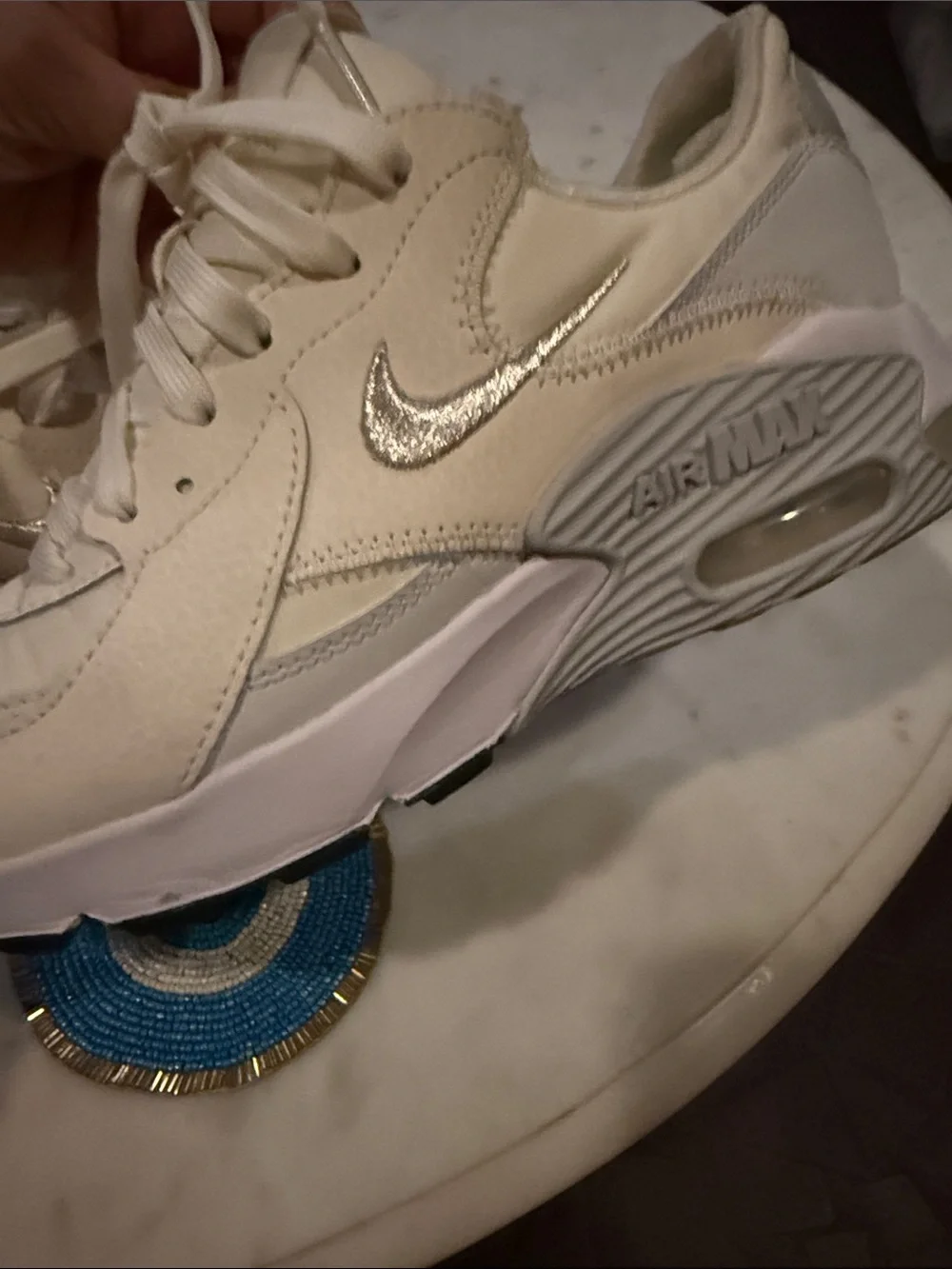 Nike Cream/White Sneakers with Metallic Swoosh